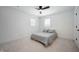 Simple bedroom design with a queen bed, plush carpet, neutral walls, and minimalist decor at 205 Poplar St, Westfield, IN 46074