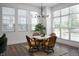 Bright dining area with large windows, modern light fixture, and seating for four at 205 Poplar St, Westfield, IN 46074