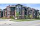 Modern townhome featuring brick and gray siding with landscaped front entrances on corner lot at 205 Poplar St, Westfield, IN 46074