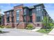 Modern townhome featuring brick and gray siding with landscaped front entrances at 205 Poplar St, Westfield, IN 46074