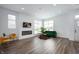 Bright, open living room with modern fireplace, neutral walls, and hardwood floors at 205 Poplar St, Westfield, IN 46074