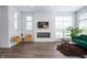 Bright, open living room with modern fireplace, neutral walls, and hardwood floors at 205 Poplar St, Westfield, IN 46074