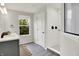Bright bathroom featuring a walk-in shower, gray cabinetry, and gray tile flooring at 2074 Tompkins Dr, Westfield, IN 46074