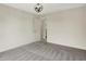 Empty bedroom with gray carpet and a modern black light fixture at 2074 Tompkins Dr, Westfield, IN 46074