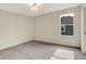 A cozy bedroom featuring gray carpeting and a view of the outdoors through the window at 2074 Tompkins Dr, Westfield, IN 46074