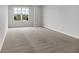 Bedroom featuring neutral walls, plush carpeting, and a window that provides ample natural light and neighborhood views at 2074 Tompkins Dr, Westfield, IN 46074