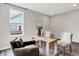 Bright home office with natural light, a light wood desk, comfortable chairs, and a view to the outside at 2074 Tompkins Dr, Westfield, IN 46074