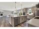 Spacious open-plan kitchen features an island and stainless steel appliances at 2074 Tompkins Dr, Westfield, IN 46074