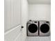 Laundry room with new stainless steel washer and dryer units against a clean, white wall at 2074 Tompkins Dr, Westfield, IN 46074