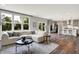 Open-concept living room with a large sofa, modern decor, and seamless access to the kitchen at 2074 Tompkins Dr, Westfield, IN 46074