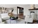 Inviting living room with fireplace, dark wood floors, and wainscotting at 2074 Tompkins Dr, Westfield, IN 46074