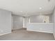 Spacious loft area with neutral carpeting and walls, offering a versatile space for relaxation or entertainment at 2074 Tompkins Dr, Westfield, IN 46074