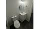 Neat bathroom with vanity, sink, mirror, lighting, and toilet with luxury vinyl plank flooring at 2127 Haines Ave, Indianapolis, IN 46221