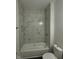Bathroom with tiled shower and tub combination, and a shower niche for storage at 2127 Haines Ave, Indianapolis, IN 46221
