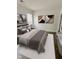Inviting bedroom featuring soft, neutral tones, plush bedding, and plenty of natural light at 2127 Haines Ave, Indianapolis, IN 46221