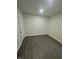 Bright, empty room featuring hardwood floors and crisp white walls at 2127 Haines Ave, Indianapolis, IN 46221