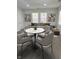 Bright living room featuring a round table, stylish chairs, and modern decor, perfect for entertaining at 2127 Haines Ave, Indianapolis, IN 46221