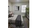 Bedroom with neutral decor, cozy bedding, stylish art and a large plant by the window at 2127 Haines Ave, Indianapolis, IN 46221