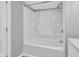 Bright bathroom features a classic white tub and shower combination at 247 N 14Th St, Noblesville, IN 46060
