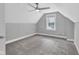 Bedroom featuring neutral walls, carpet, ceiling fan and a bright window at 247 N 14Th St, Noblesville, IN 46060