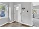 Bright foyer area with window, white door, and durable flooring creating a welcoming entrance at 247 N 14Th St, Noblesville, IN 46060