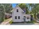 Charming two-story home featuring a tidy front yard, classic architectural details, and a welcoming blue front door at 247 N 14Th St, Noblesville, IN 46060