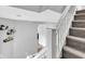 Carpeted staircase with white banister leads to the upper level at 247 N 14Th St, Noblesville, IN 46060
