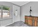 Warm and inviting home entryway with a decorative front door, stylish flooring, and designer cabinet at 247 N 14Th St, Noblesville, IN 46060