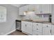 Kitchen featuring white cabinets, stainless steel appliances, and stylish countertops at 247 N 14Th St, Noblesville, IN 46060