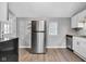 Kitchen with stainless steel appliances and modern lighting at 247 N 14Th St, Noblesville, IN 46060