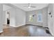 Well-lit living room featuring modern flooring, a contemporary ceiling fan, and ample natural light at 247 N 14Th St, Noblesville, IN 46060
