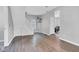Open-concept living area with sleek flooring, neutral walls, and staircase that brings together style and functionality at 247 N 14Th St, Noblesville, IN 46060