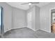 Neutral bedroom features plush carpet, ceiling fan, and closet at 247 N 14Th St, Noblesville, IN 46060