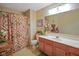 Bathroom featuring a vanity with cabinets, toilet, and patterned shower curtain at 255 Bastion Pl # Apt D, Avon, IN 46123