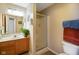 This bathroom features a single-sink vanity and walk-in shower with a sliding glass door at 255 Bastion Pl # Apt D, Avon, IN 46123
