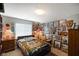 Comfortable bedroom featuring personal decor, natural light, and side tables at 255 Bastion Pl # Apt D, Avon, IN 46123
