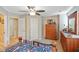 Bedroom featuring a comfortable bed, wooden dresser, and natural light at 255 Bastion Pl # Apt D, Avon, IN 46123