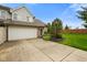 Charming townhome featuring an attached two-car garage, mature trees, and manicured lawns at 255 Bastion Pl # Apt D, Avon, IN 46123