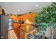 Well-lit kitchen with oak cabinets, stainless steel appliances, and decorative plants at 255 Bastion Pl # Apt D, Avon, IN 46123