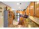 Kitchen featuring oak cabinets, stainless steel appliances, and a tile floor at 255 Bastion Pl # Apt D, Avon, IN 46123