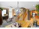 Inviting living room featuring a cozy seating area, staircase, and chandelier lighting fixture at 255 Bastion Pl # Apt D, Avon, IN 46123