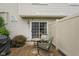 Outdoor patio features two chairs and table, offering a cozy spot for relaxing and entertaining guests at 255 Bastion Pl # Apt D, Avon, IN 46123