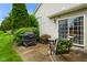 Outdoor patio features two chairs and table, offering a cozy spot for relaxing and entertaining guests at 255 Bastion Pl # Apt D, Avon, IN 46123