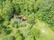 An aerial view of the property features a small body of water and mature trees, creating a natural setting at 2825 E 216Th St, Cicero, IN 46034