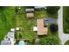 Aerial view of the property featuring a well-maintained lawn, outbuilding, and a convenient driveway at , Shelbyville, IN 46176