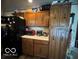 A functional kitchen with wood cabinets and essential appliances at , Shelbyville, IN 46176