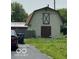 View of the back building featuring a gravel road and grassy lawn at , Shelbyville, IN 46176