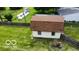 Backyard view of the home's outbuilding, in a yard with a wood fence and green grass at , Shelbyville, IN 46176