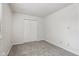 Clean bedroom with plush carpet, a window, and double door closet at 3430 Whalen Ave, Indianapolis, IN 46227
