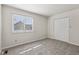 Cozy bedroom with a large window and a double door closet at 3430 Whalen Ave, Indianapolis, IN 46227
